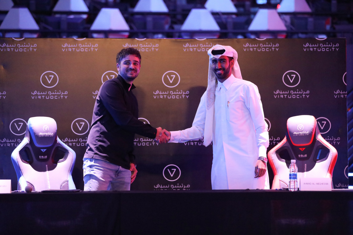 Virtuocity Center Manager Ionut Stefan Negru and eSports star Ahmed Al Meghessib during the contract signing, yesterday.