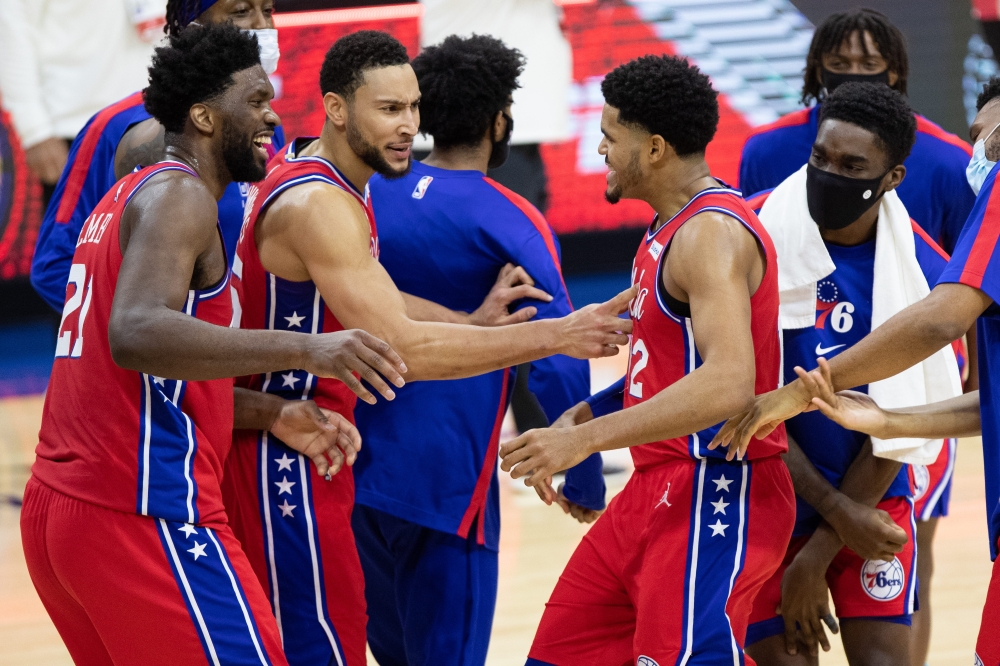 Philadelphia 76ers forward Tobias Harris (12) celebrates with guard Ben Simmons (25) and center Joel Embiid (21) after scoring the game winning basket during the fourth quarter against the Los Angeles Lakers at Wells Fargo Center. Bill Streicher