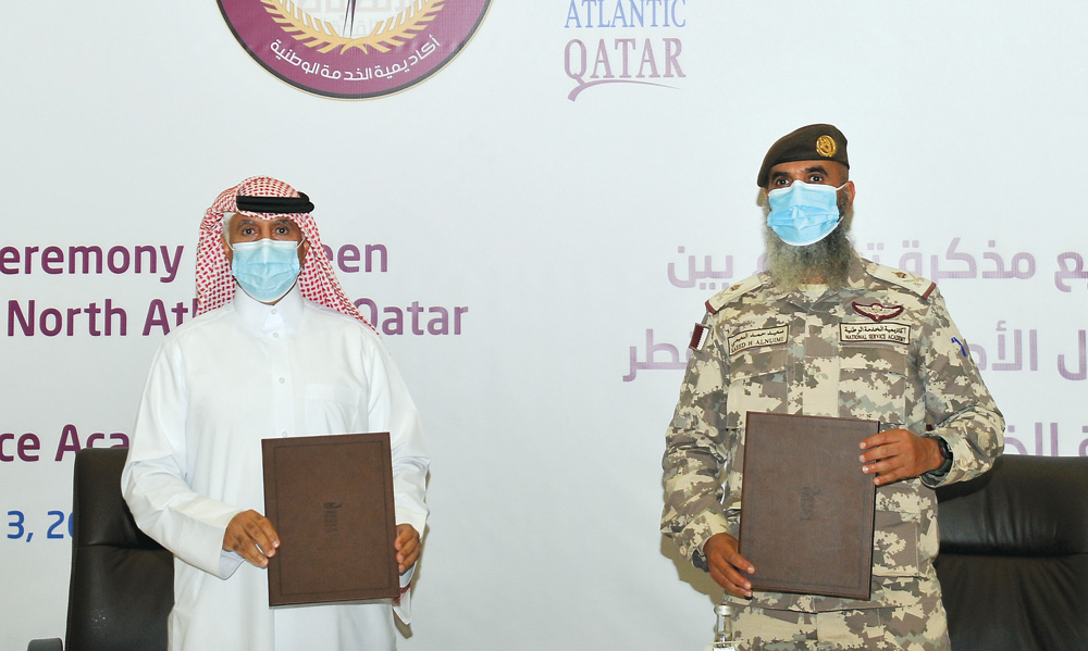 President of CNA-Q, Dr Salem Al Naemi (left) and National Service Academy (NSA) President, Staff Major General Saeed bin Hamad Al Nuaimi pose after signing an MOU at a function held at the NSA yesterday. PIC: Salim Matramkot/ The Peninsula.