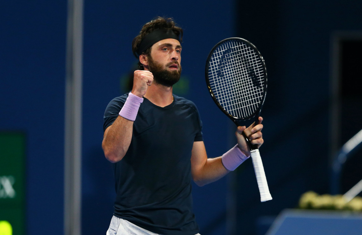 Nikoloz Basilashvili of Georgia celebrates his victory over Switzerland's Roger Federer during the Qatar ExxonMobil Open at the Khalifa International Tennis and Squash Complex yesterday.???????