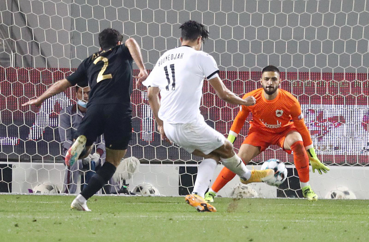 Al Sadd's Baghdad Bounedjah shoots at the goal during the match against Al Rayyan yesterday.