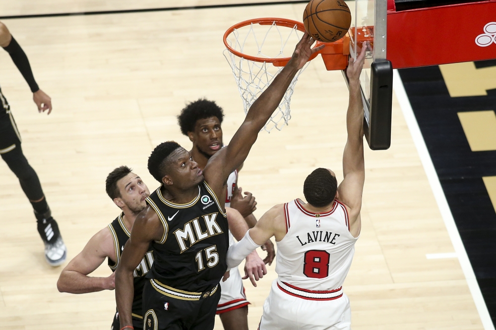 Atlanta Hawks center Clint Capela (15) defends the shot of Chicago Bulls guard Zach LaVine (8) in the fourth quarter at State Farm Arena.