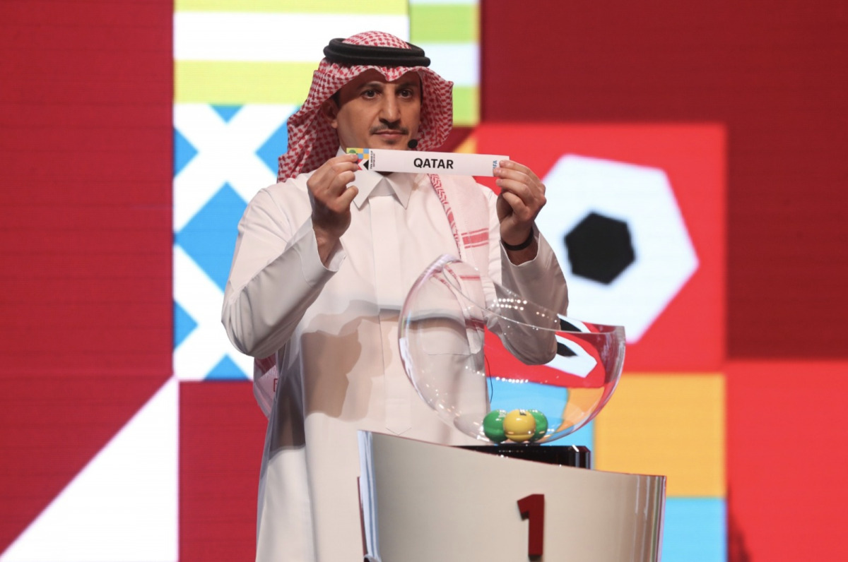 Saudi Arabia's legend Nawaf Al Temyat picks Qatar during the draw ceremony.