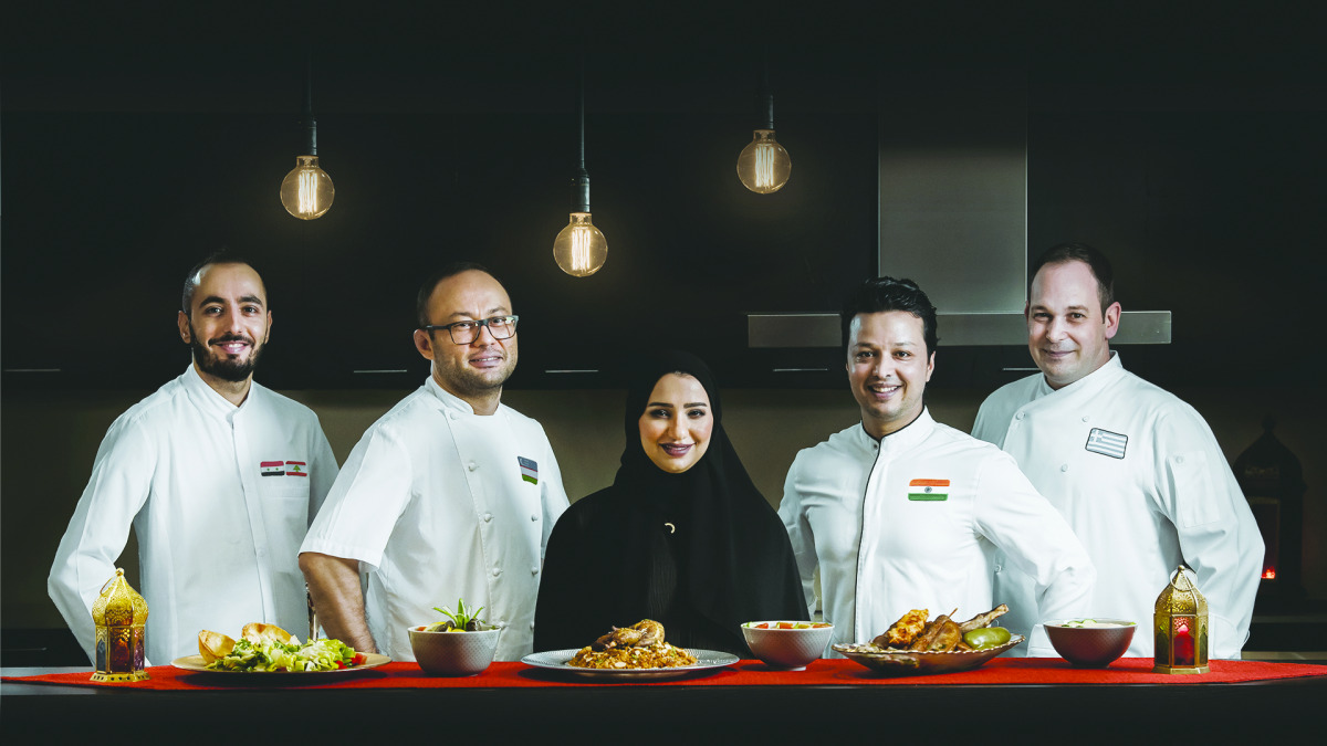 Chefs pose for a photograph during Chefs of Qatar Virtual Food Festival.