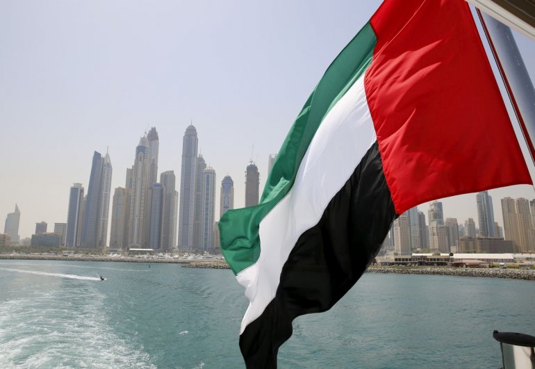 UAE flag flies over a boat at Dubai Marina, Dubai, United Arab Emirates. Reuters/Ahmed Jadallah
