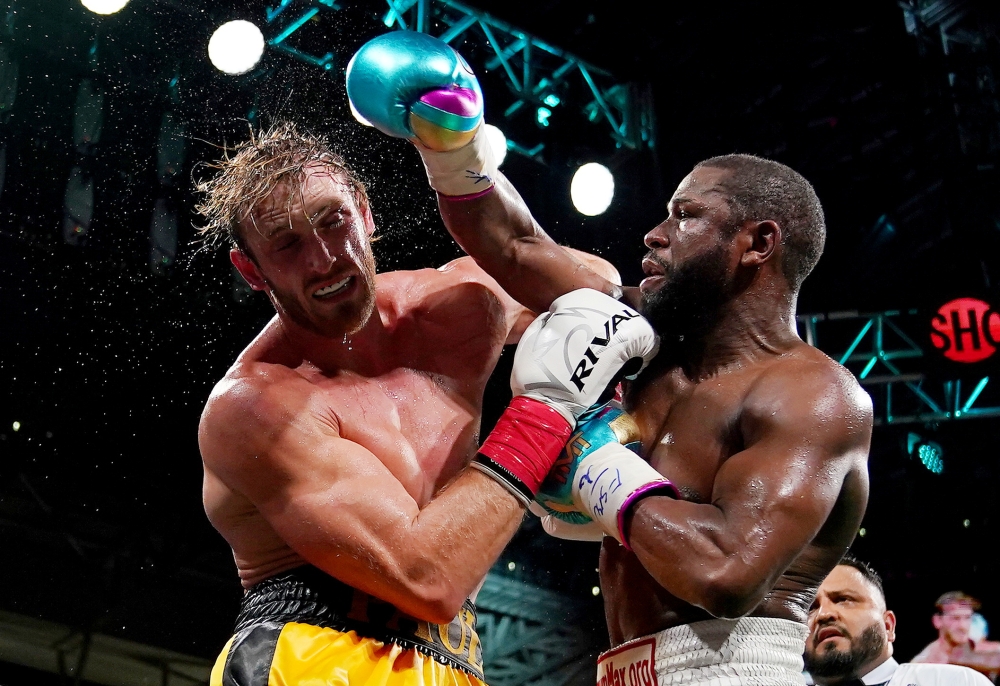 Floyd Mayweather Jr. (Green Trunks) fights Logan Paul (Yellow Trunks) during an exhibition boxing match at Hard Rock Stadium. (Jasen Vinlove-USA TODAY Sports)