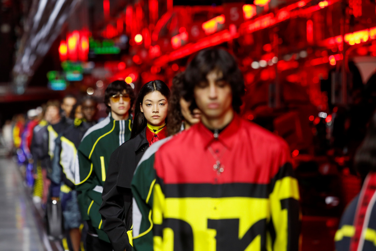 Models present outfits from luxury carmaker Ferrari's first internally-designed fashion collection for women and men as the first step of its rebooted brand extension strategy, in Maranello, Italy, June 13, 2021. REUTERS/Remo Casilli