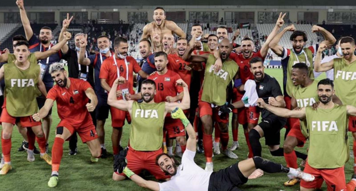 Palestine players and officials celebrate after the victory yesterday