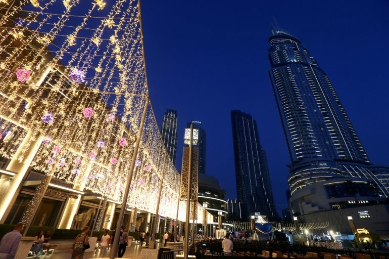 People walk outside The Dubai Mall in Dubai, United Arab Emirates. (Reuters/Satish Kumar/File Photo)