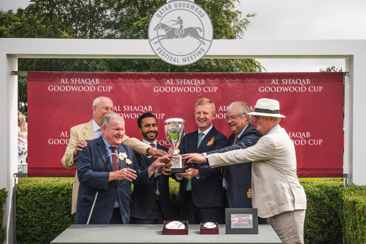 Jassim Moftah J M Al Moftah, Acting Deputy Ambassador of Qatar to the UK, presents the trophy to connection of Trueshan, which won the Al Shaqab Goodwood Cup Stakes (Group One) at Qatar Goodwood Festival yesterday.