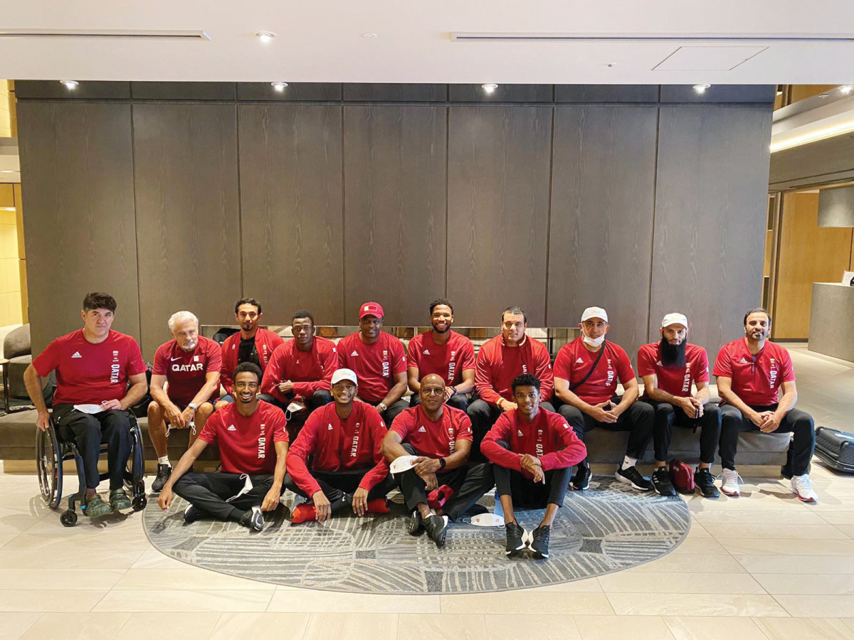 Team Qatar athletes and officials pose for a photograph after arriving in Tokyo from Takasaki, yesterday.