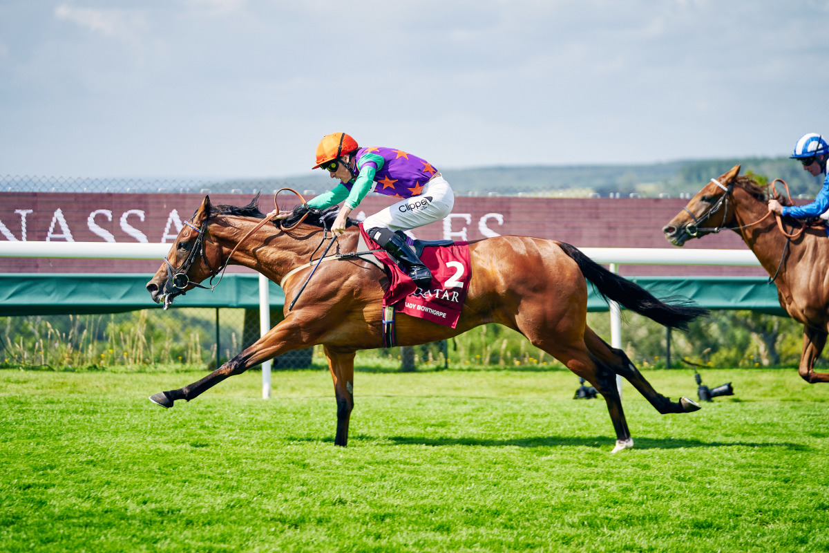 Jockey Kieran Shoemark guides Lady Bowthorpe towards the victory in the Qatar Nassau Stakes on the third day of the Qatar Goodwood Festival yesterday.  