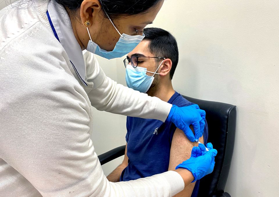 A man receives a dose of a vaccine against the coronavirus disease (COVID-19), in Dubai, United Arab Emirates December 28, 2020. REUTERS/Abdel Hadi Ramahi/File Photo

