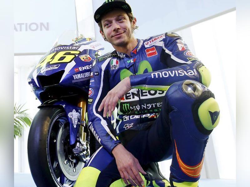 FILE PHOTO: Yamaha's MotoGP rider Valentino Rossi poses with the new Yamaha YZR-M1 for the 2016 season in Barcelona, Spain, January 18, 2016. REUTERS/Albert Gea
