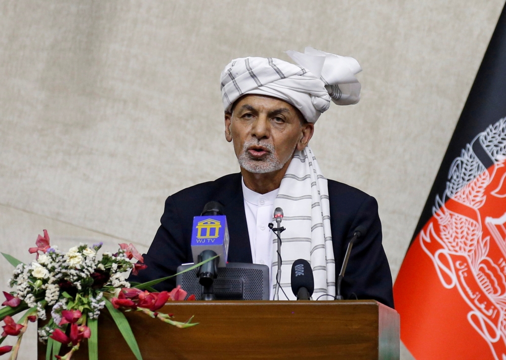 FILE PHOTO: Afghan President Ashraf Ghani speaks at the parliament in Kabul, Afghanistan August 2, 2021. REUTERS