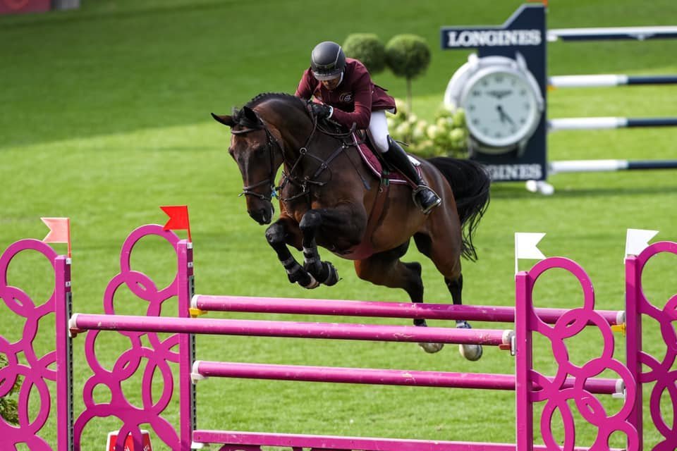 Doha Falcons' Qatari rider  Bassem Mohammed guides Gunder over an obstacle.