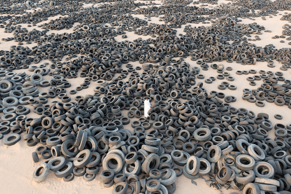 A general view shows used tyres in front of tyres recycling factory in Al Salmi area, Kuwait, yesterday.