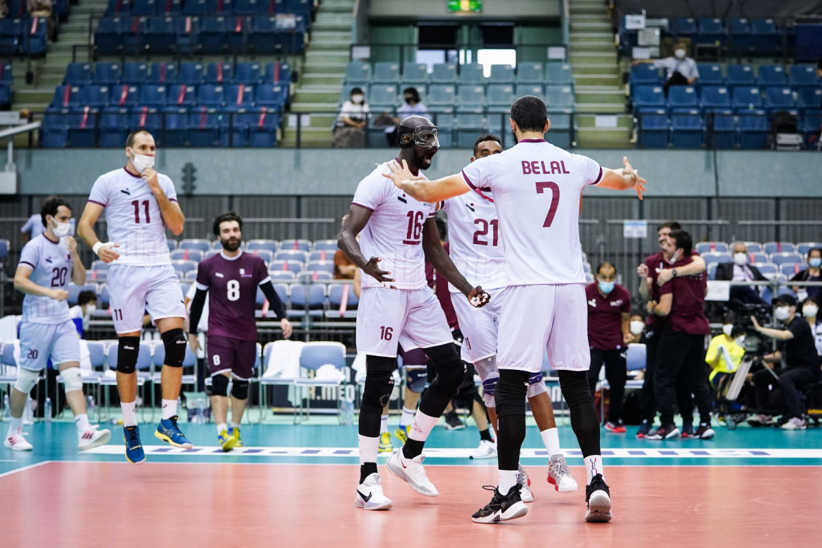 Qatar players celebrate their win.