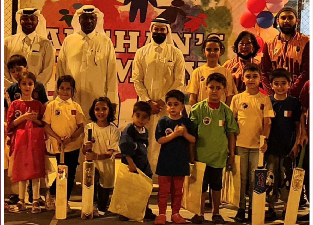 Qatar Rugby, Hockey and Cricket Federation officials pose for a group picture with Afghan children after organising various sports events for them in Doha. The families of the children also attended the events.