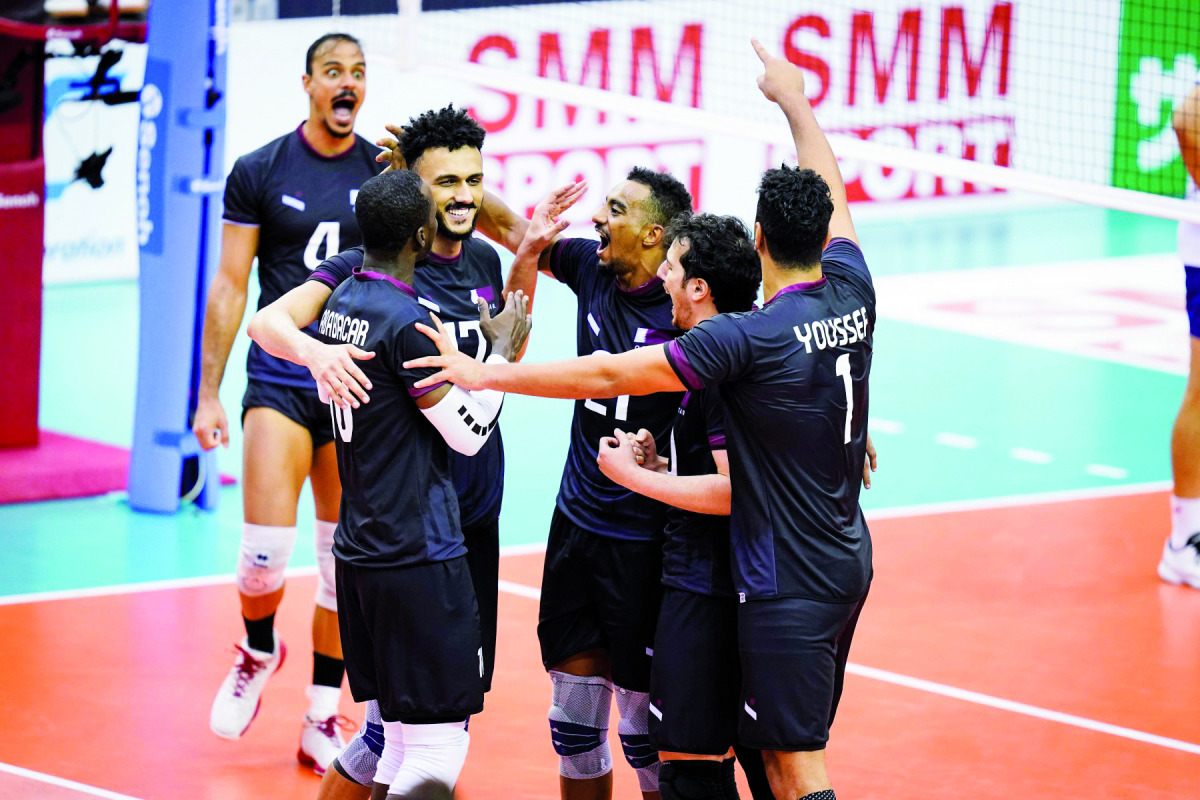 Qatari players celebrate after defeating South Korea.