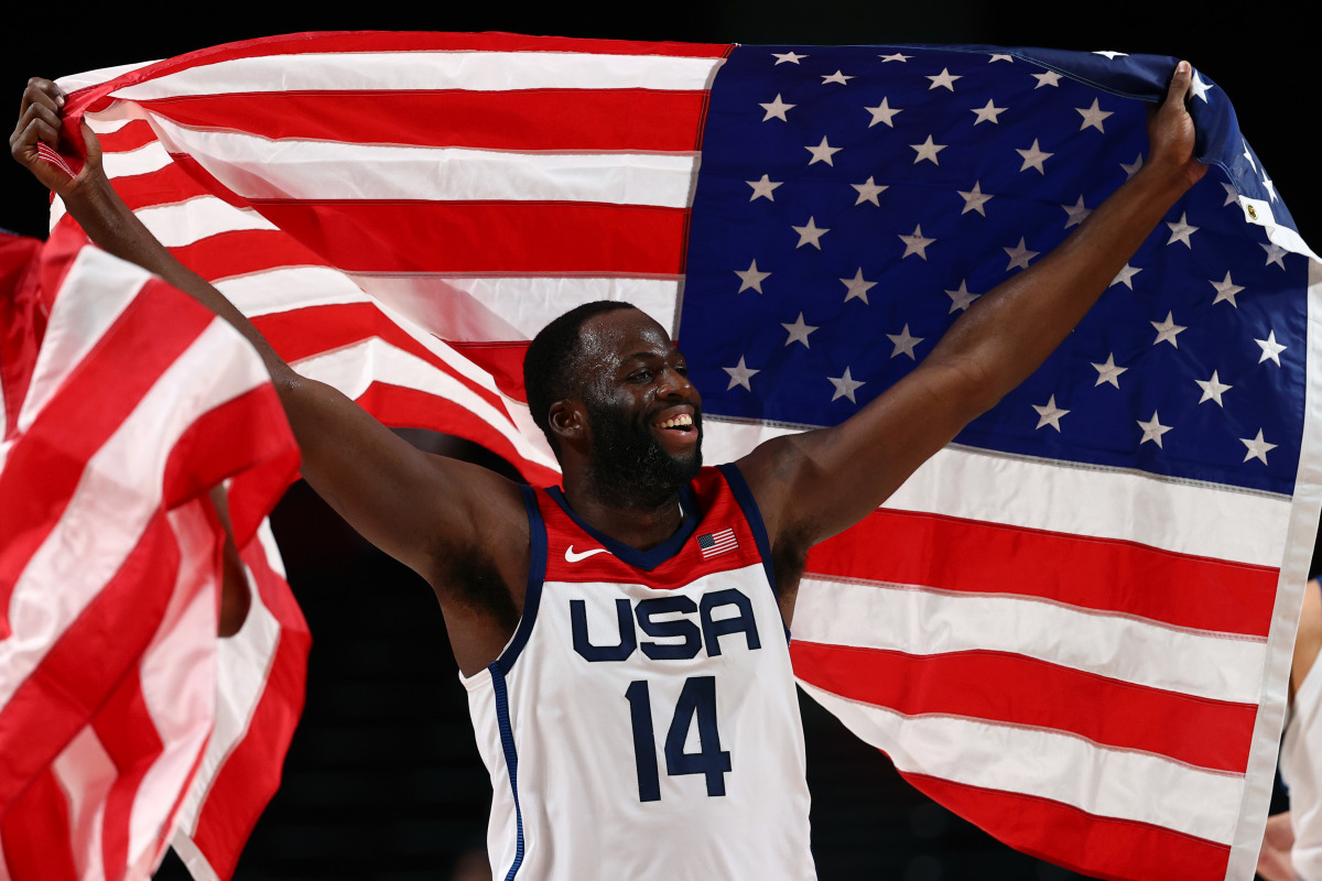 Draymond Green of the United States celebrates after winning the gold medal match against France as he waves the United States flag REUTERS/Sergio Perez

