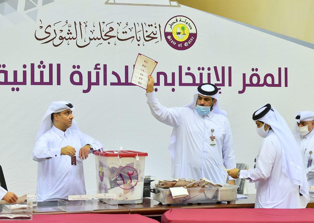 Officials count ballots cast during the Shura Council elections yesterday.