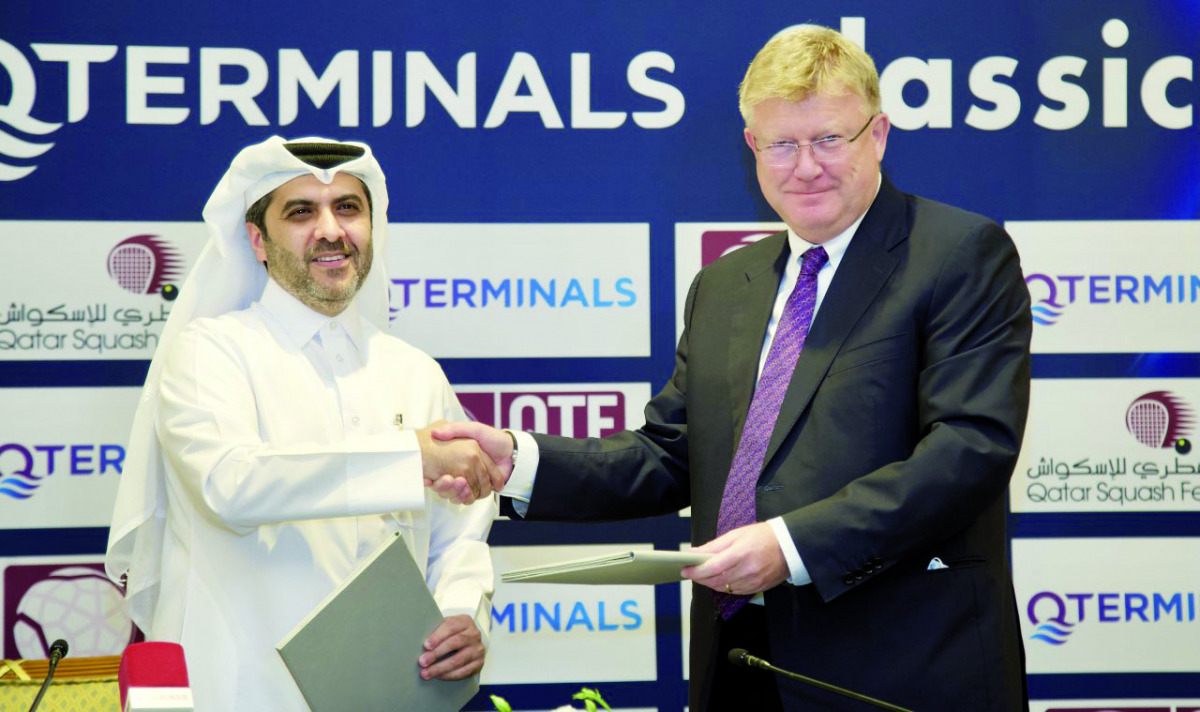 QTSBF Secretary General Tariq Zainal and QTerminals Chief Executive Director Neville Bissett shake hands after the signing ceremony yesterday.  