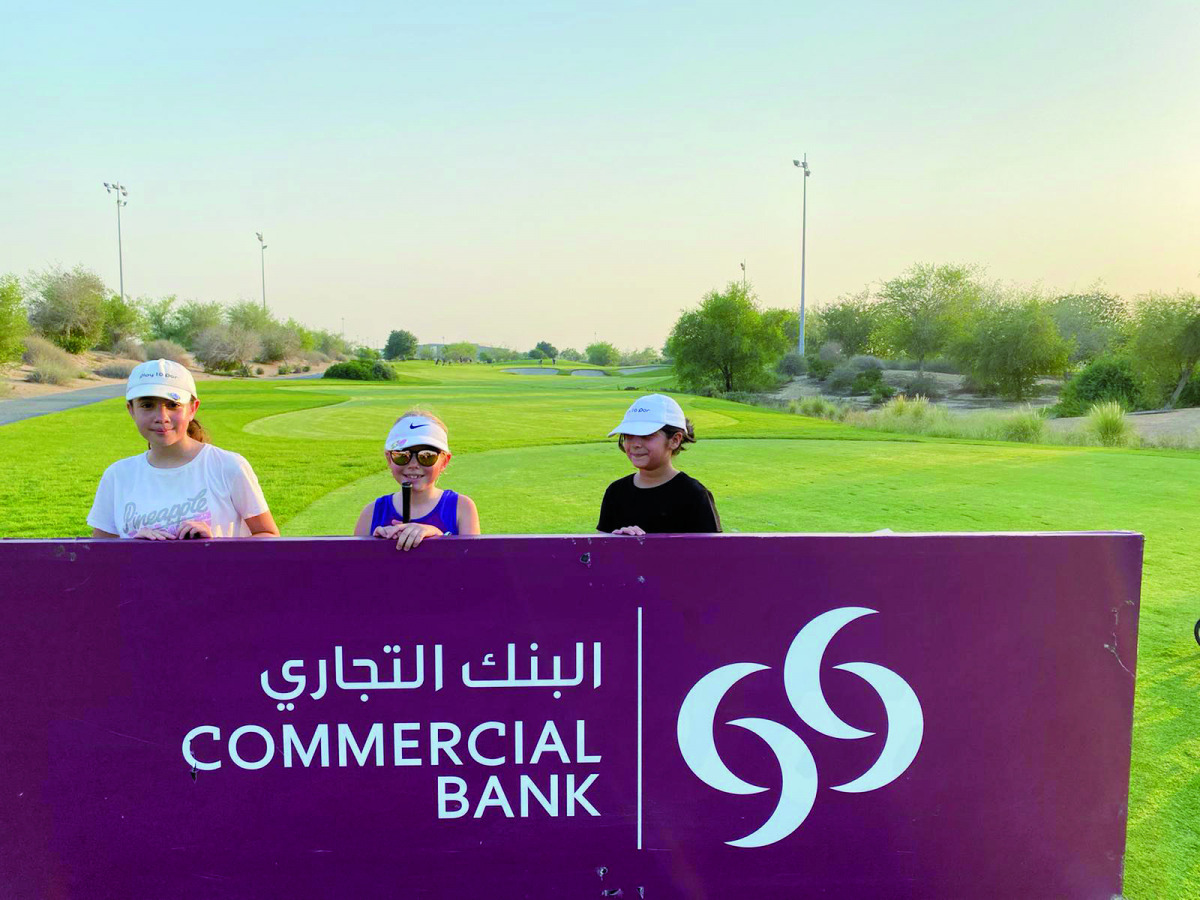 Participating young golfers pose for a photo.