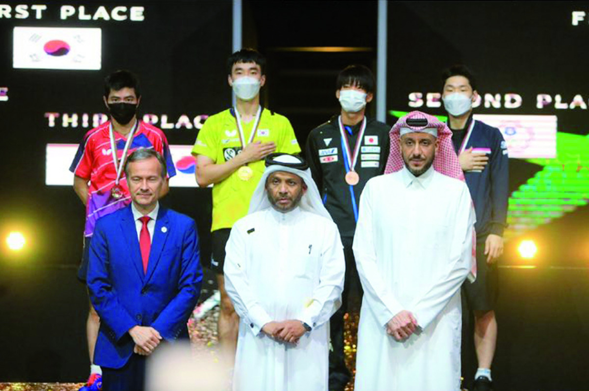 Asian Table Tennis Union President Khalil Al Mohannadi and other officials pose for a photograph with the men's singles podium winners.