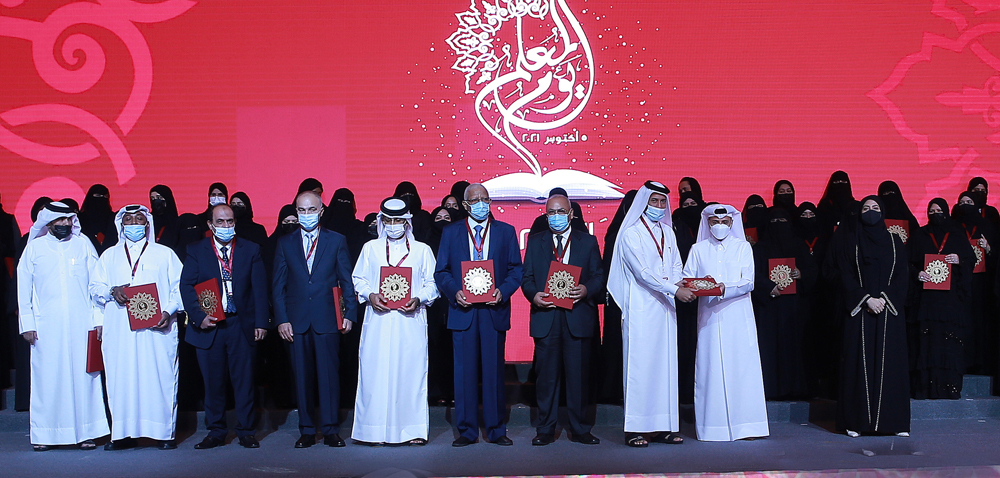 Minister of Education and Higher Education H E Dr. Mohammed bin Abdulwahed Al Hammadi with officials and honourees at the event to mark the World Teachers’ Day.