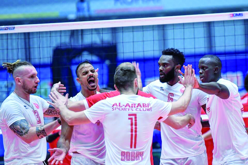 Al Arabi players celebrate after winning yesterday's match.