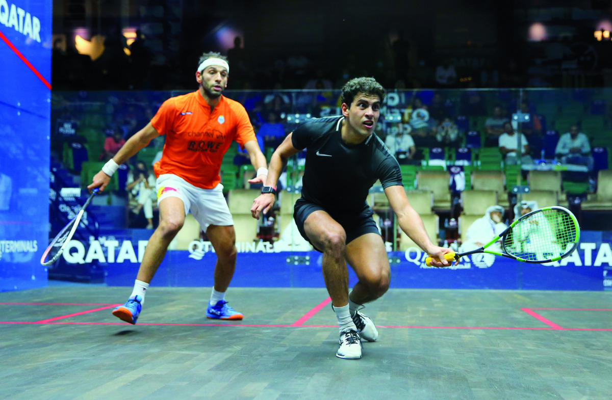 Egypt's Youssef Ibrahim plays a shot against compatriot Mohamed ElShorbagy during their second round match of the Qatar QTerminal Classic at the Khalifa International Tennis and Squash Complex, yesterday.