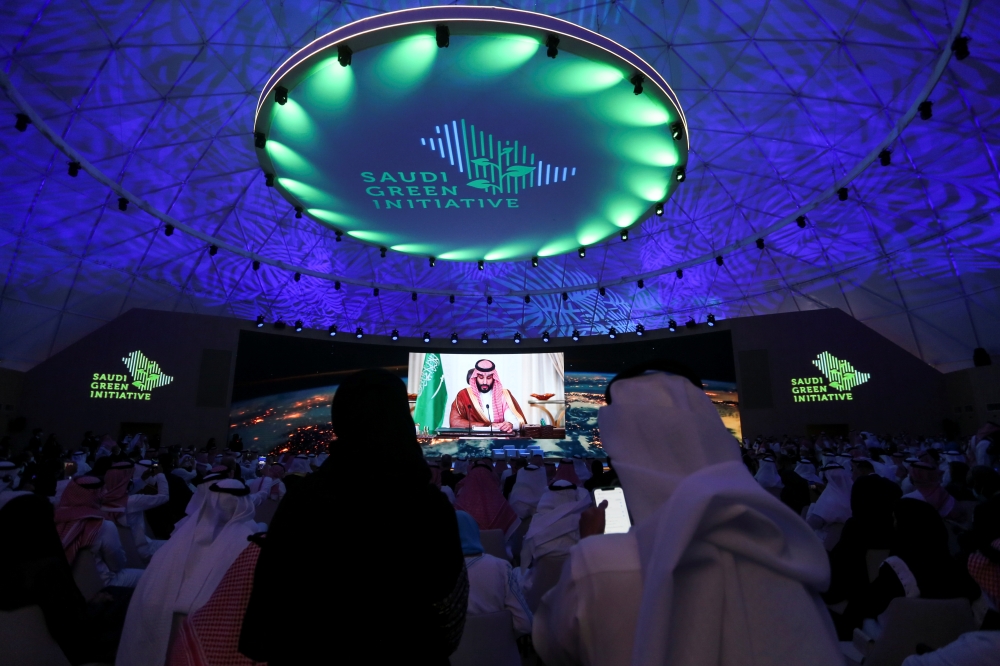 Saudi Arabia's Crown Prince Mohammed bin Salman is seen on the screen during the Saudi Green Initiative Forum organised to discuss efforts by the world's top oil exporter to tackle climate change in Riyadh, Saudi Arabia, October 23, 2021. Reuters/Ahmed Yo