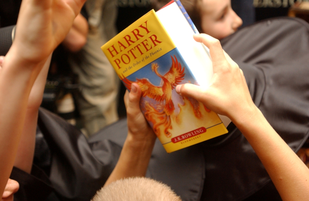 A child holds a copy of 