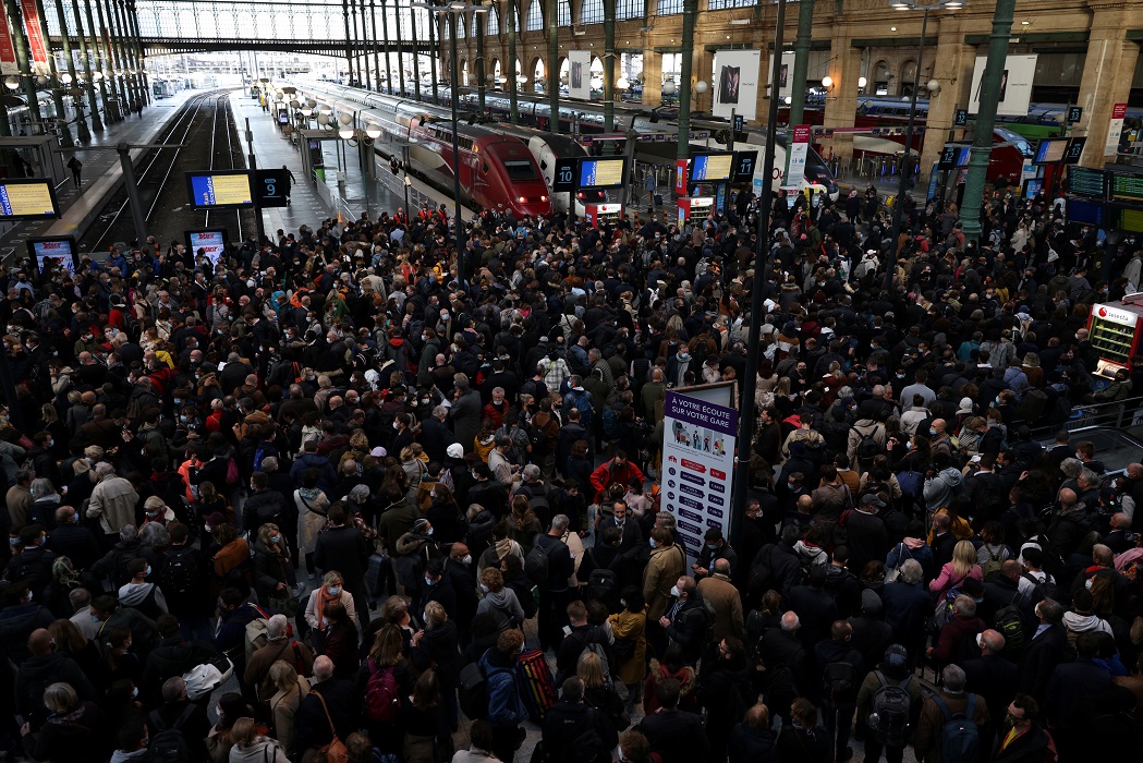 Passengers are seen inside the Gare du Nord train station which re-opened after been temporarily evacuated in Paris, France, October 27, 2021. REUTERS/Kevin Coombs