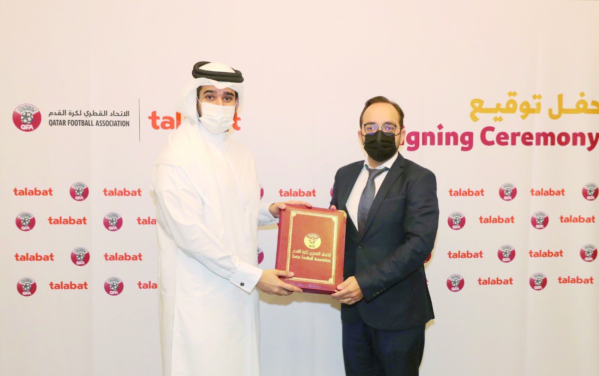 Qatar Football Association Secretary-General Mansoor Al Ansari and talabat Qatar Managing Director Francisco Miguel De Sousa during a sponsorship signing ceremony in Doha, yesterday.