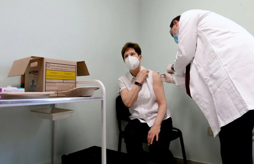 Healthcare worker Adrienne Kertesz, receives the first injection nationwide, with a dose of Pfizer-BioNTech COVID-19 vaccine at the Del-Pest Central Hospital as the coronavirus disease (COVID-19) outbreak continues, in Budapest, Hungary, December 26, 2020