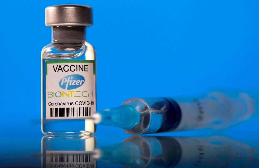 A vial labelled with the Pfizer-BioNTech coronavirus disease (COVID-19) vaccine is seen in this illustration picture taken March 19, 2021. REUTERS/Dado Ruvic/File Photo