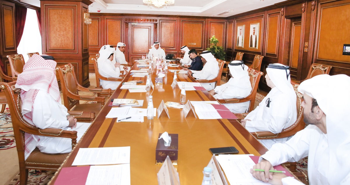 Minister of Labour H E Dr Ali bin Saeed bin Samikh Al Marri chairing the meeting of the National Committee to Combat Human Trafficking, yesterday.
