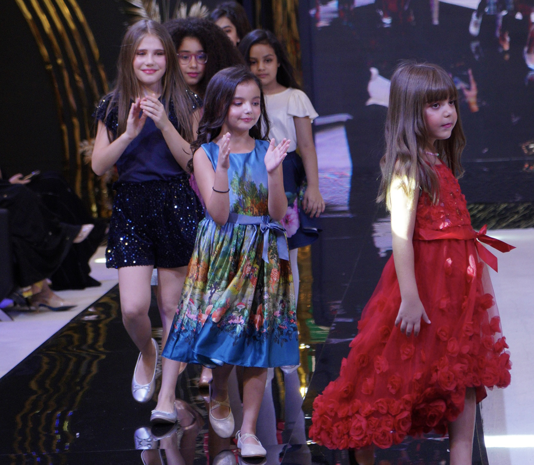 Children participate in the 'Fashion Festival' at Doha Festival City.  