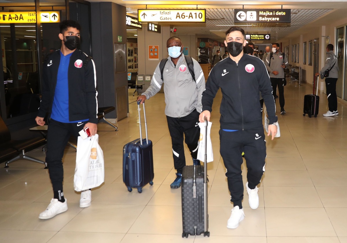 Qatar's Bassam Al Rawi (right) and team-mates arrive in Belgrade last night for the game against Serbia.