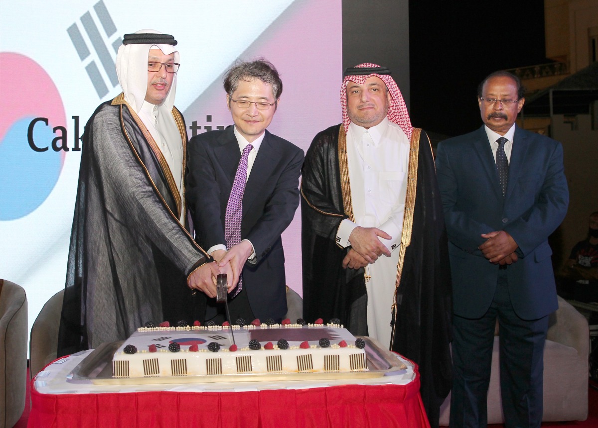 Minister of Communications and Information Technology H E Mohammed bin Ali Al Mannai and Ambassador of South Korea to Qatar Joon-ho  Lee, jointly cutting a cake during the Korean National Day celebrations held at the InterContinental Hotel in Doha on Thursday. The Director of Department of Protocol at the Ministry of Foreign Affairs H E Ambassador Ibrahim Fakhroo (second right) and the Dean of Diplomatic Corps, Ambassador of Eritrea to Qatar, H E Ali Ibrahim Ahmed (right) and several other diplomats and dignitaries were present at the event. Pic: Salim Matramkot/The Peninsula