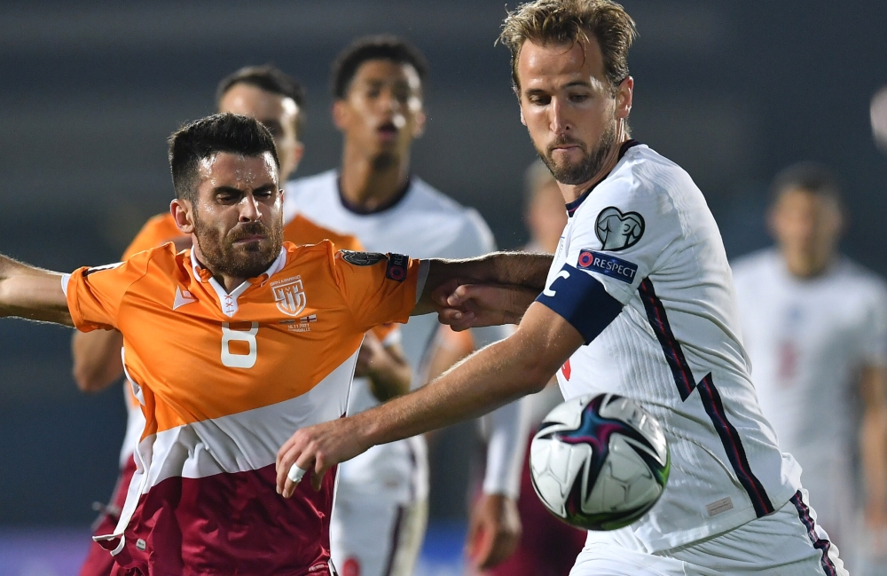 San Marino's Enrico Golinucci in action with England's Harry Kane Reuters/Jennifer Lorenzini