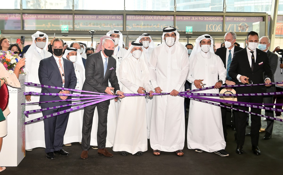 Minister of Commerce and Industry H E Sheikh Mohammed bin Hamad bin Qassim Al Abdullah Al Thani, Chairman of Qatar Tourism and Qatar Airways Group Chief Executive H E Akbar Al Baker with other dignitaries and officials during the opening ceremony of Qatar Travel Mart 2021 at Doha Exhibition and Convention Center, yesterday.