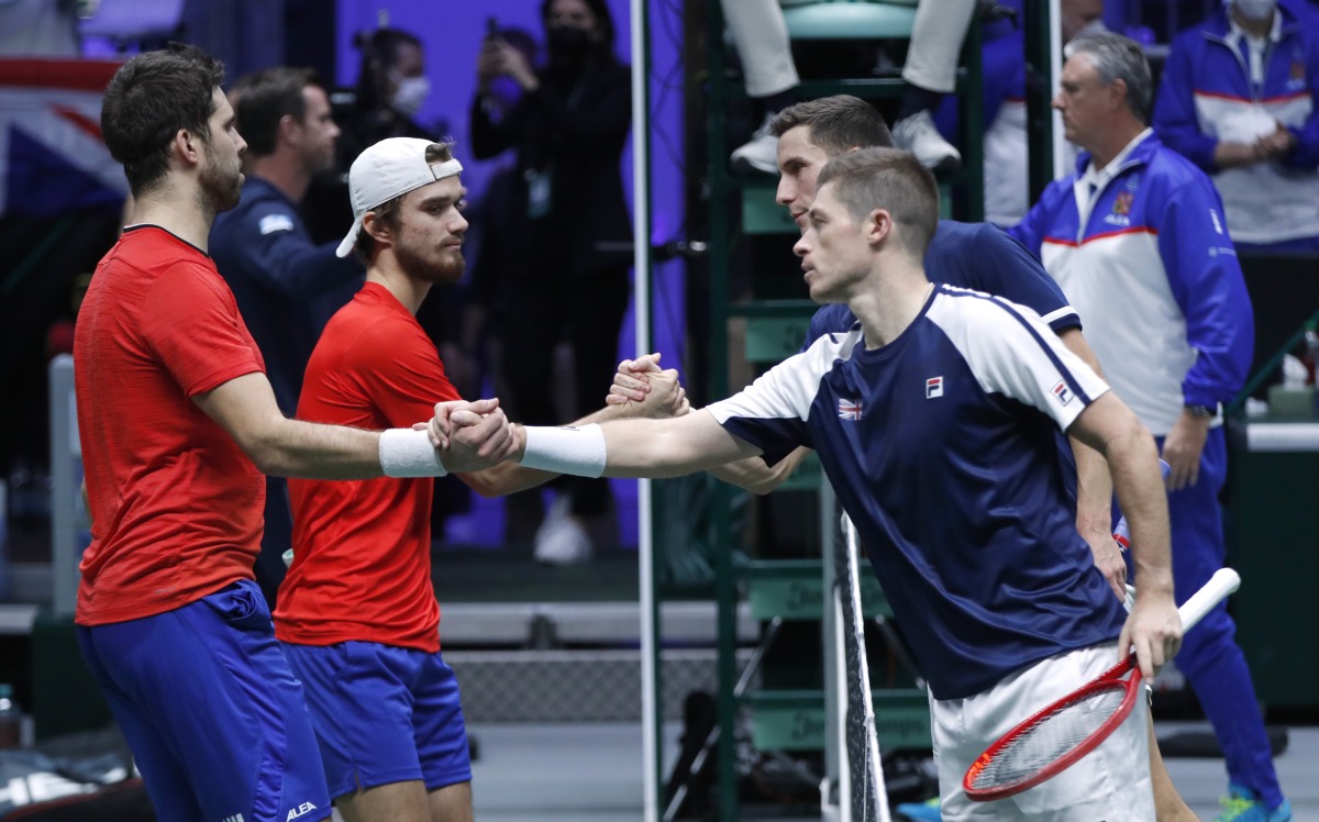 Britain's Joe Salisbury and Neal Skupski shakes hands with Czech Republic's Tomas Machac and Jiri Vesely after winning their doubles match REUTERS/Leonhard Foeger