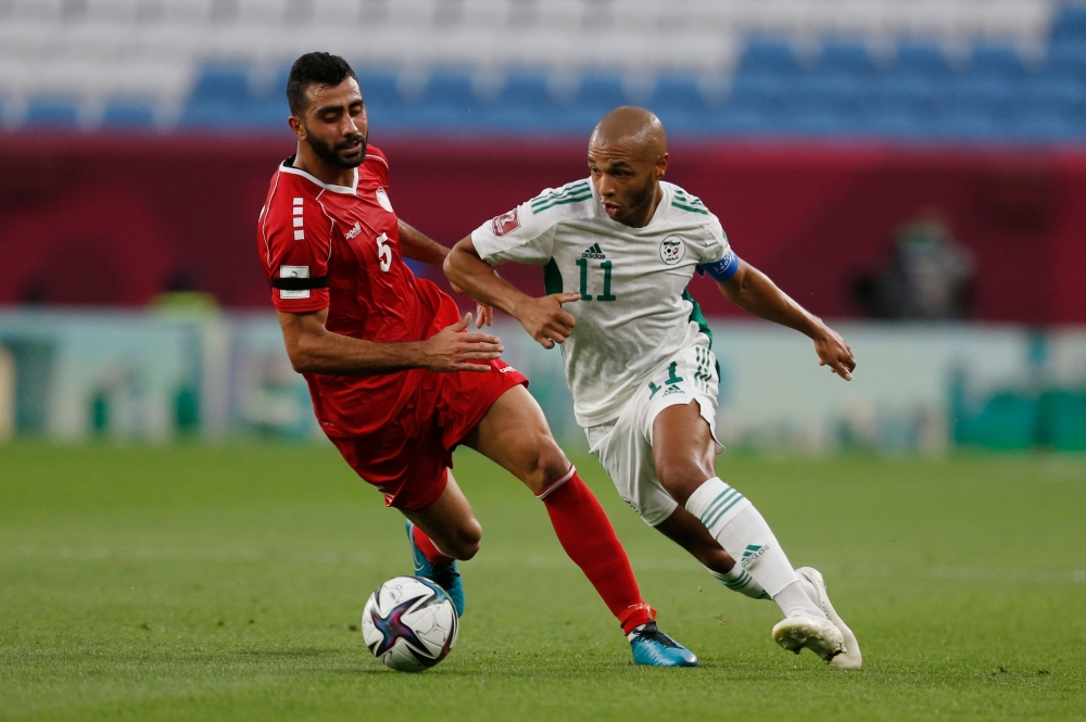 December 4, 2021 Algeria's Yacine Brahimi in action with Lebanon's Jihad Ayoub REUTERS/Amr Abdallah Dalsh