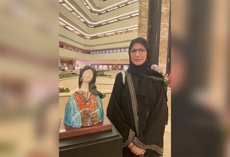 Qatari artist Haifa Al Khuzai with one of her ceramic pieces during the art exhibition “Al Naghda: Elegance from the past,” being held at Sheraton Grand Doha.  Pic: Joelyn Baluyut/The Peninsula