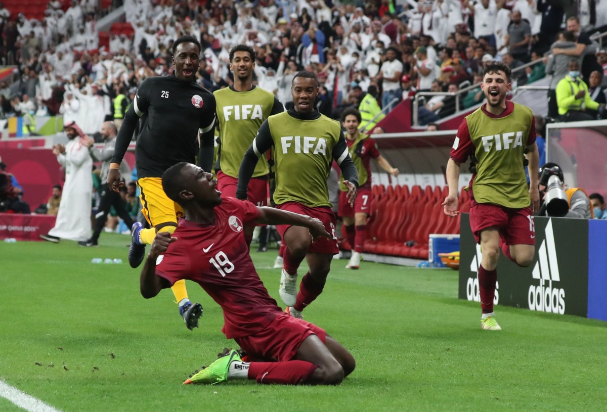 Almoez Ali celebrates after scoring Qatar's first goal against Iraq at Al Bayt Stadium, yesterday.