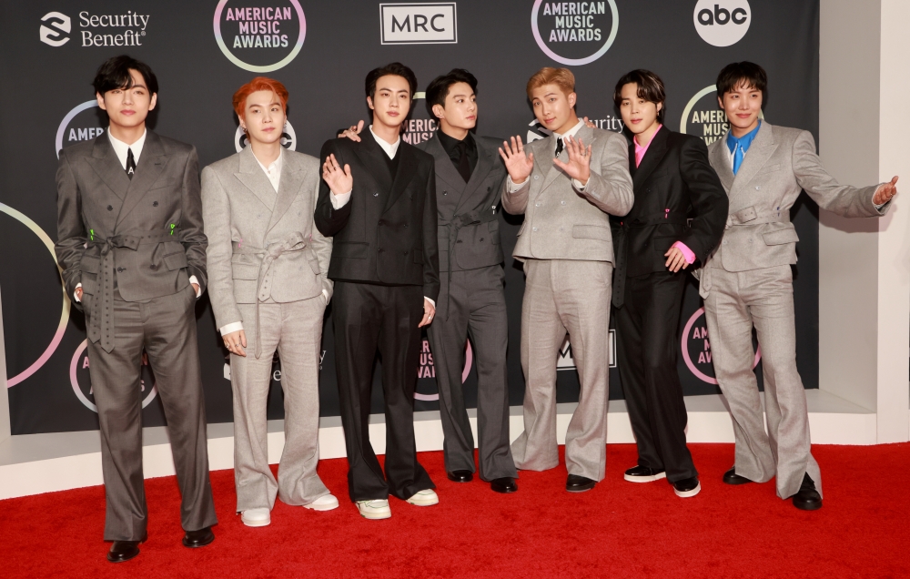 V, Suga, Jin, Jungkook, RM, Jimin and J-Hope of BTS arrive at the 2021 American Music Awards at the Microsoft Theater in Los Angeles, California, U.S., November 21, 2021. REUTERS/Aude Guerrucci/File Photo