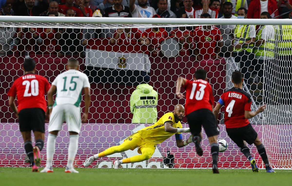 Egypt’s Amr El Soulia scores from the penalty spot.